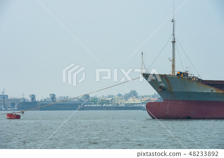 large cargo ship moves towards the exit large cargo ship moves towards the exit 48233892