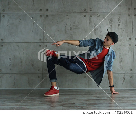Teen boy dancing break dance 48236001