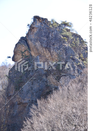 Strange rock with a height of 60 m 48236128