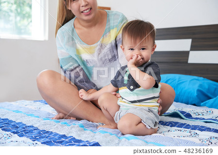 Shy little boy 48236169