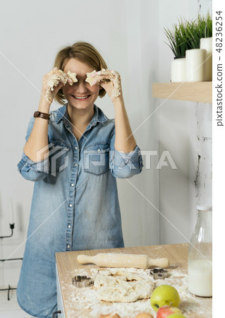 Girl preparing food in kitchen 48236254