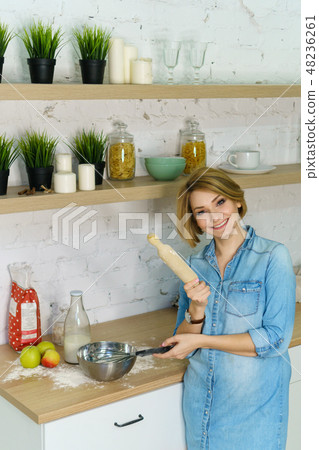 Girl preparing food in kitchen 48236261