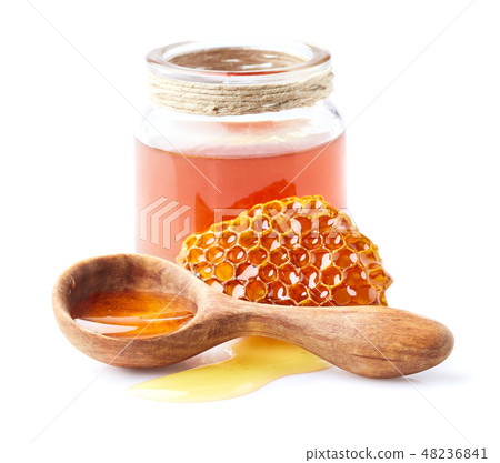 Honey and honeycomb in closeup Honey and honeycomb in closeup 48236841