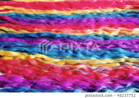 Yarn with colorfully colored folded and extended sideways Yarn with colorfully colored folded and extended sideways 48237752