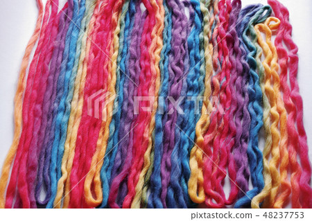 Colorful colored wool yarn folded back in landscape length 48237753