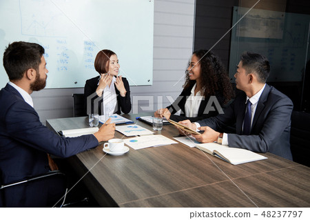Smiling businesswoman explaining company perspectives 48237797