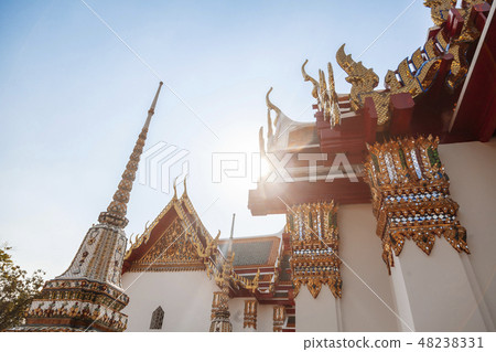 Beautiful Buddhist temple Wat Pho in the capital of Thailand Bangkok against the blue sky, 48238331