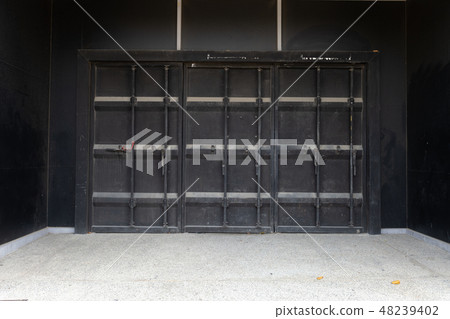 sidewalk by street wall & door sidewalk by street wall & door 48239402