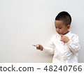 sick boy with thermometer on white background 48240766
