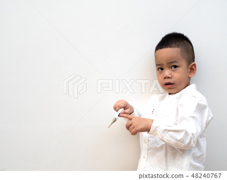 sick boy with thermometer on white background 48240767