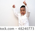 very happy asian boy making thumbs up sign 48240773
