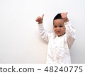 very happy asian boy making thumbs up sign  48240775