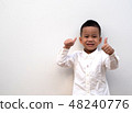 very happy asian boy making thumbs up sign  48240776