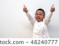 very happy asian boy making thumbs up sign 48240777