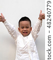 very happy asian boy making thumbs up sign 48240779