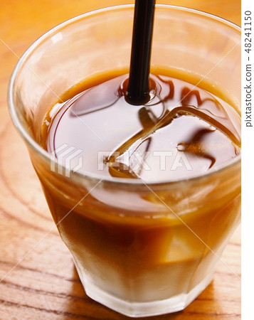 Ice café au lait with floating ice 48241150