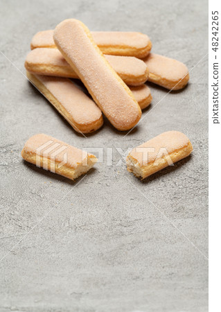 Italian Savoiardi ladyfingers Biscuits on concrete backgound Italian Savoiardi ladyfingers Biscuits on concrete backgound 48242265