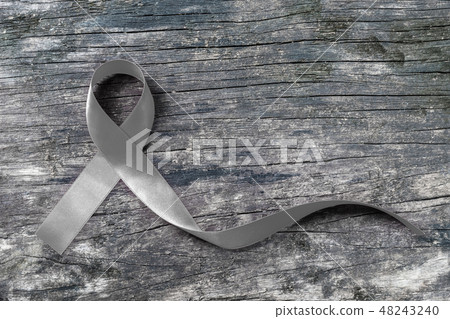 Brain cancer awareness with grey color ribbon  48243240