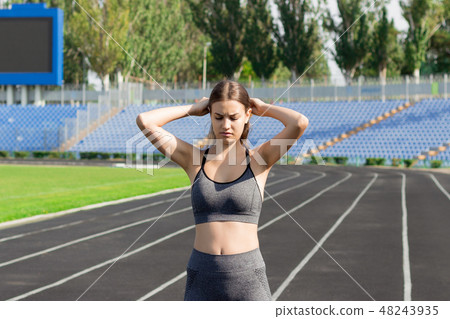 Young sports fitness woman warming up, Young sports fitness woman warming up, 48243935