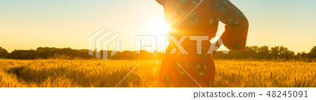 African woman in traditional clothes at sunset 48245091