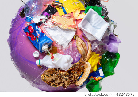 A globe of the earth with trash over white background, the concept of ecology problem 48248573