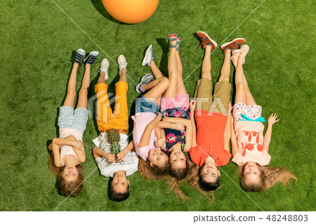 Group of happy children playing outdoors. Group of happy children playing outdoors. 48248803