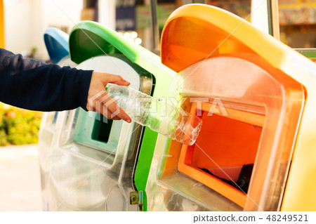 woman hand throwing away garbage to bin trash woman hand throwing away garbage to bin trash 48249521