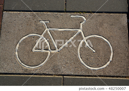 Bicycle track with sign on concrete pavement Bicycle track with sign on concrete pavement 48250007