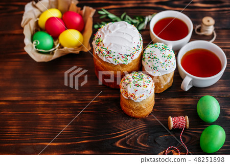 Easter cake and colorful eggs on a dark background Easter cake and colorful eggs on a dark background 48251898