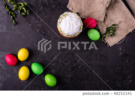 Easter cake and colorful eggs on a dark background Easter cake and colorful eggs on a dark background 48252141