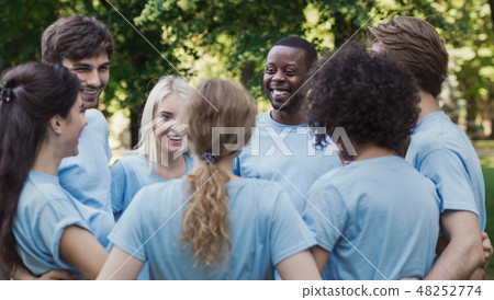 Meeting of young volunteers team in park 48252774