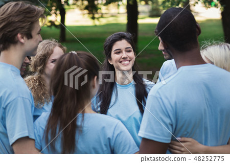 Meeting of young volunteers team in park 48252775