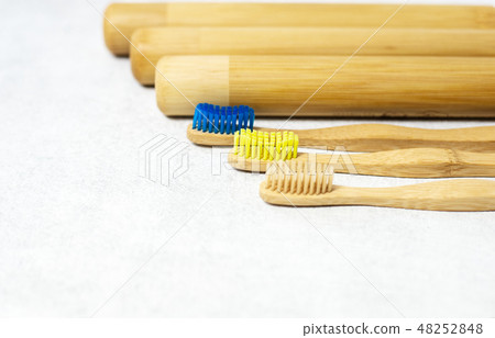 A family set of wooden bamboo toothbrushes on white background 48252848