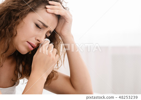 Sad young woman cry using tissue paper 48253239