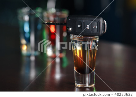 Drinking and driving concept. Car key on a wooden table, pub Drinking and driving concept. Car key on a wooden table, pub 48253622