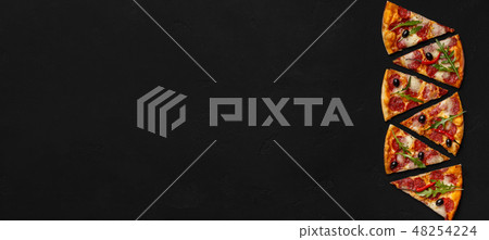 Slices of delicious pizza with salami on black background Slices of delicious pizza with salami on black background 48254224