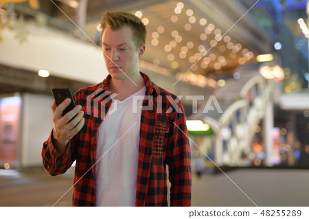 Young Handsome Hipster Man Using Phone In The City At Night 48255289