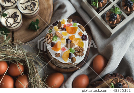 Easter cake with dried fruits and eggs top view 48255391