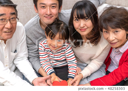 Three generations of happy families with a family of five together with a heart mark Three generations of happy families with a family of five together with a heart mark 48258303