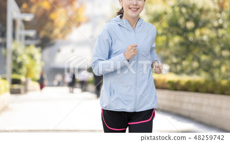 Jogging Young lady city running image Jogging Young lady city running image 48259742