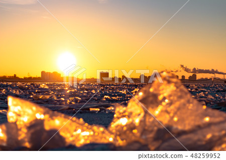 View of the city of Khabarovsk from the Amur river at dawn. Frozen river. The industrial look. 48259952