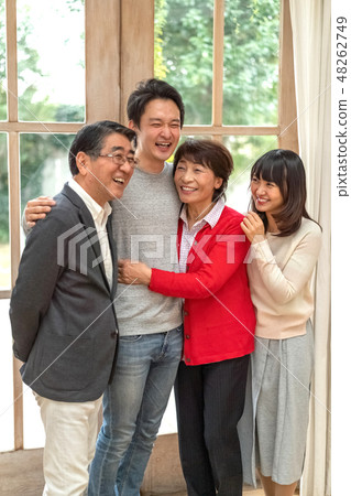 A wonderful smile of a powerful parent and child and four families blowing away everything with laughter 48262749