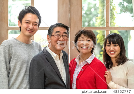 A wonderful smile of a powerful parent and child and four families blowing away everything with laughter 48262777