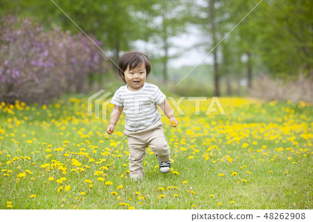 Children playing in flower garden 48262908