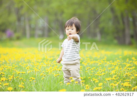 Children playing in flower garden 48262917