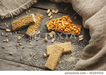 Assorted kozinaki, on old vintage background Assorted kozinaki, on old vintage background 48264456