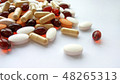 Pills, tablets and capsules on white background 48265313