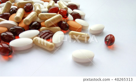 Pills, tablets and capsules on white background Pills, tablets and capsules on white background 48265313
