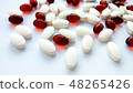 Red and white pharmaceutical medicine pills 48265426