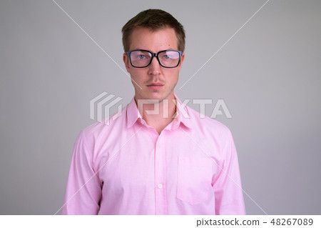 Face of young handsome nerd businessman with eyeglasses Face of young handsome nerd businessman with eyeglasses 48267089
